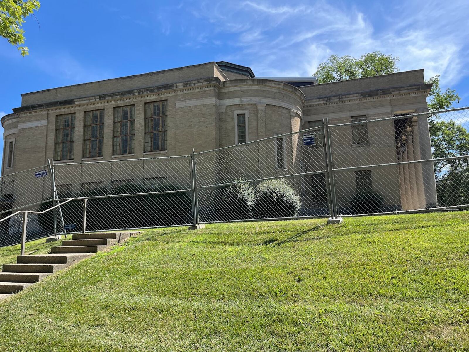 The former church was being fenced off at 105 Sawmill Road in south Dayton Tuesday. The city of Dayton has issued a commercial wrecking permit for the site. THOMAS GNAU/STAFF