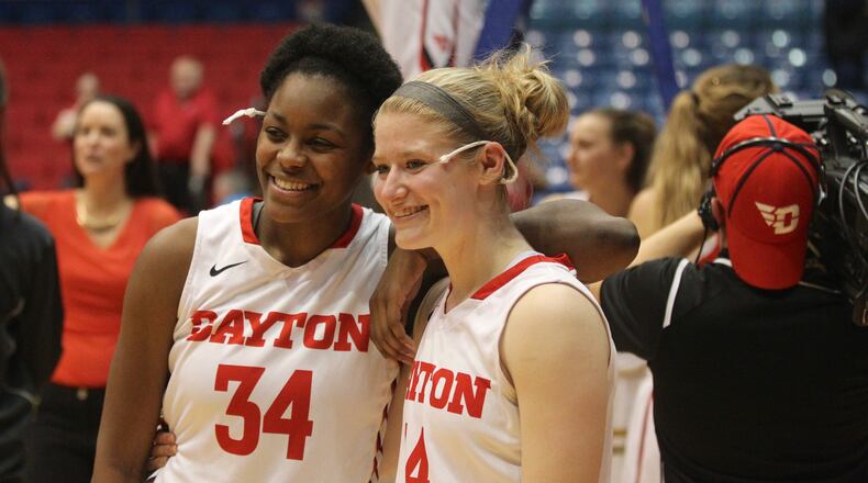 JaVonna Layfield and Jenna Burdette pose for a photo after Dayton beat Saint Louis to clinch the A-10 regular-season championship on Feb. 22, 2017, at UD Arena. David Jablonski/Staff