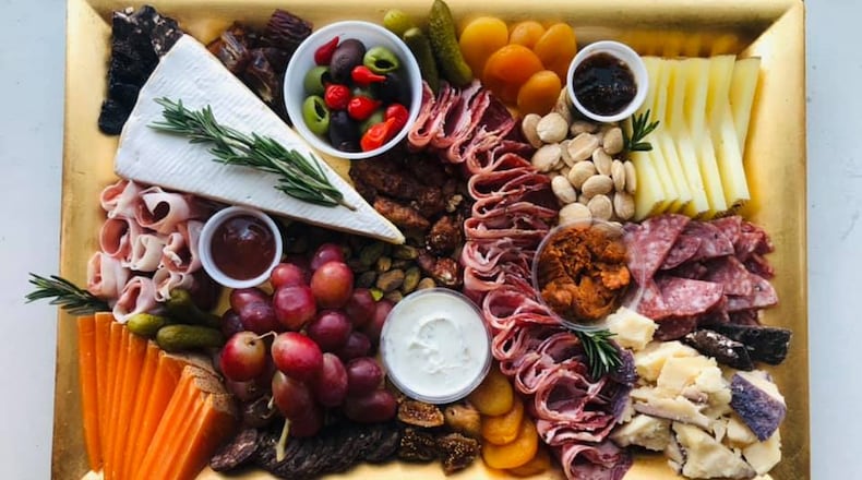 A Charcuterie by Marie charcuterie board.