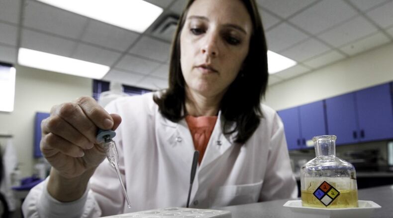 Brooke Ehlers, technical leader of the Miami Valley Regional Crime Laboratory’s Chemistry Section, tests a drug sample for fentanyl. The highly potent synthetic opioid — often cut with heroin or used alone — has been on the streets around Dayton and Springfield since at least 2015.