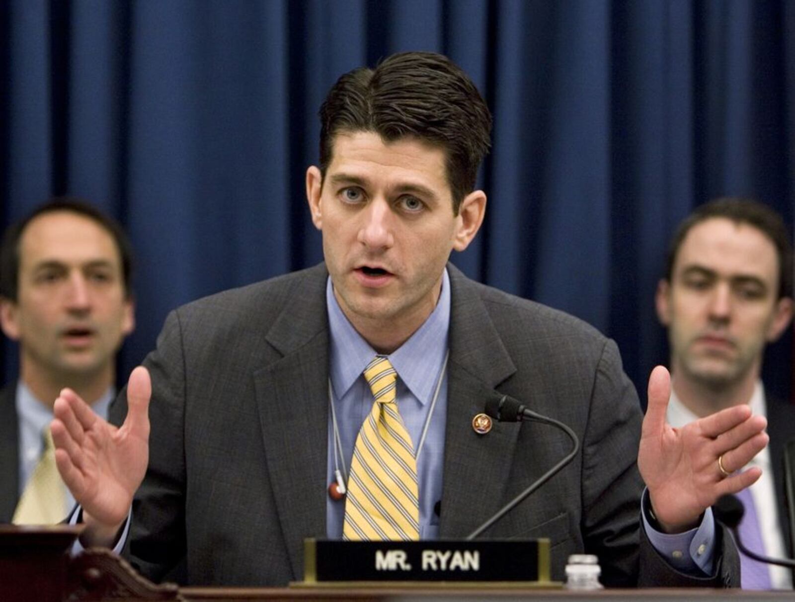 FILE - In this Feb. 13, 2008, file photo, Rep. Paul Ryan, R-Wis., questions Treasury Secretary Henry Paulson about the state of the American economy on Capitol Hill in Washington.