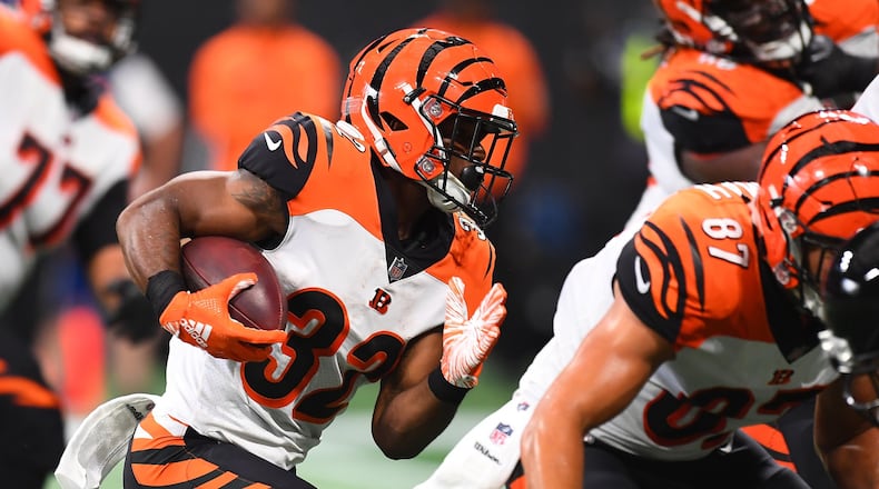 Mark Walton #32 of the Cincinnati Bengals runs the ball during the fourth quarter against the Atlanta Falcons at Mercedes-Benz Stadium on September 30, 2018, in Atlanta, Georgia. (Photo by Scott Cunningham/Getty Images)