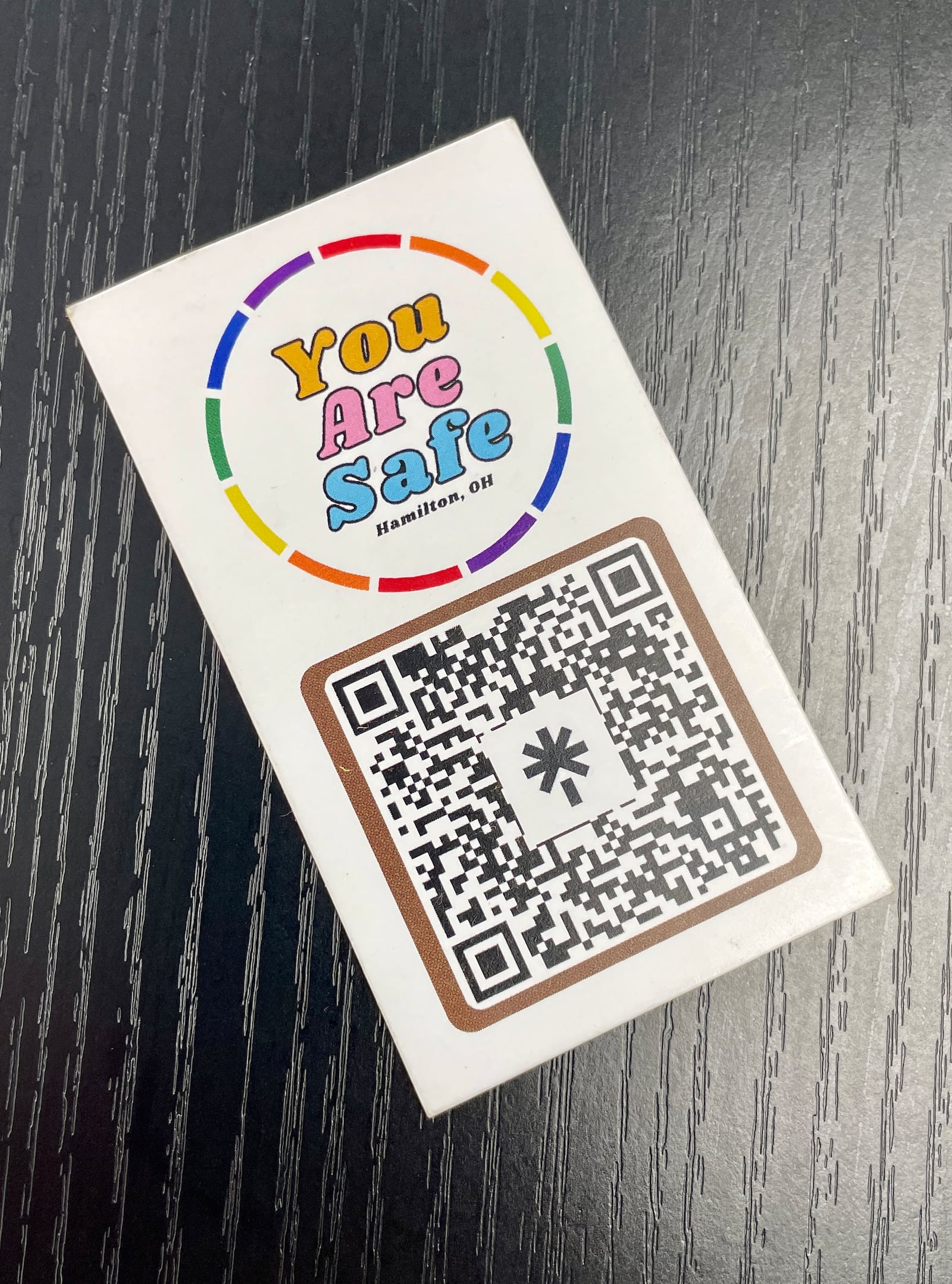 Joan Trent (they/them) started a push to highlight safe places for marginalized groups, such as LGBTQ+, minorities, etc. Pictured is a card that is passed out to help people find those businesses and organizations committed to be a safe place for marginalized people. MICHAEL D. PITMAN/STAFF