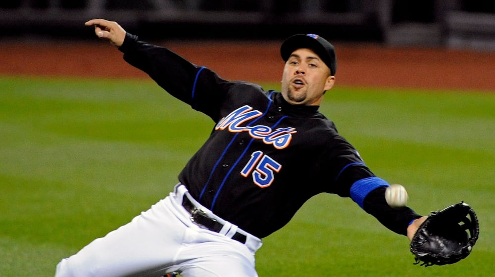 FILE - New York Mets right fielder Carlos Beltran lunges for the ball during the third inning of an MLB baseball game against the Arizona Diamondbacks, April 22, 2011 in New York. (AP Photo/Bill Kostroun, File)