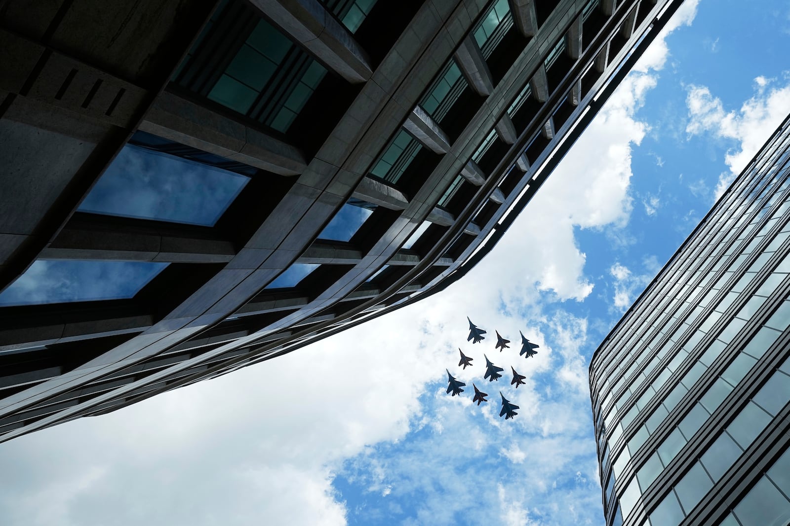 Russian Sukhoi Su-30SM jet fighters of The Russian Knights aerobatic team and Mikoyan MiG-29 jet fighters of The Swifts aerobatic team fly towards the Red Square for the Victory Day military parade general rehearsal in Moscow, Russia, Wednesday, May 7, 2025. (AP Photo/Pavel Bednyakov)