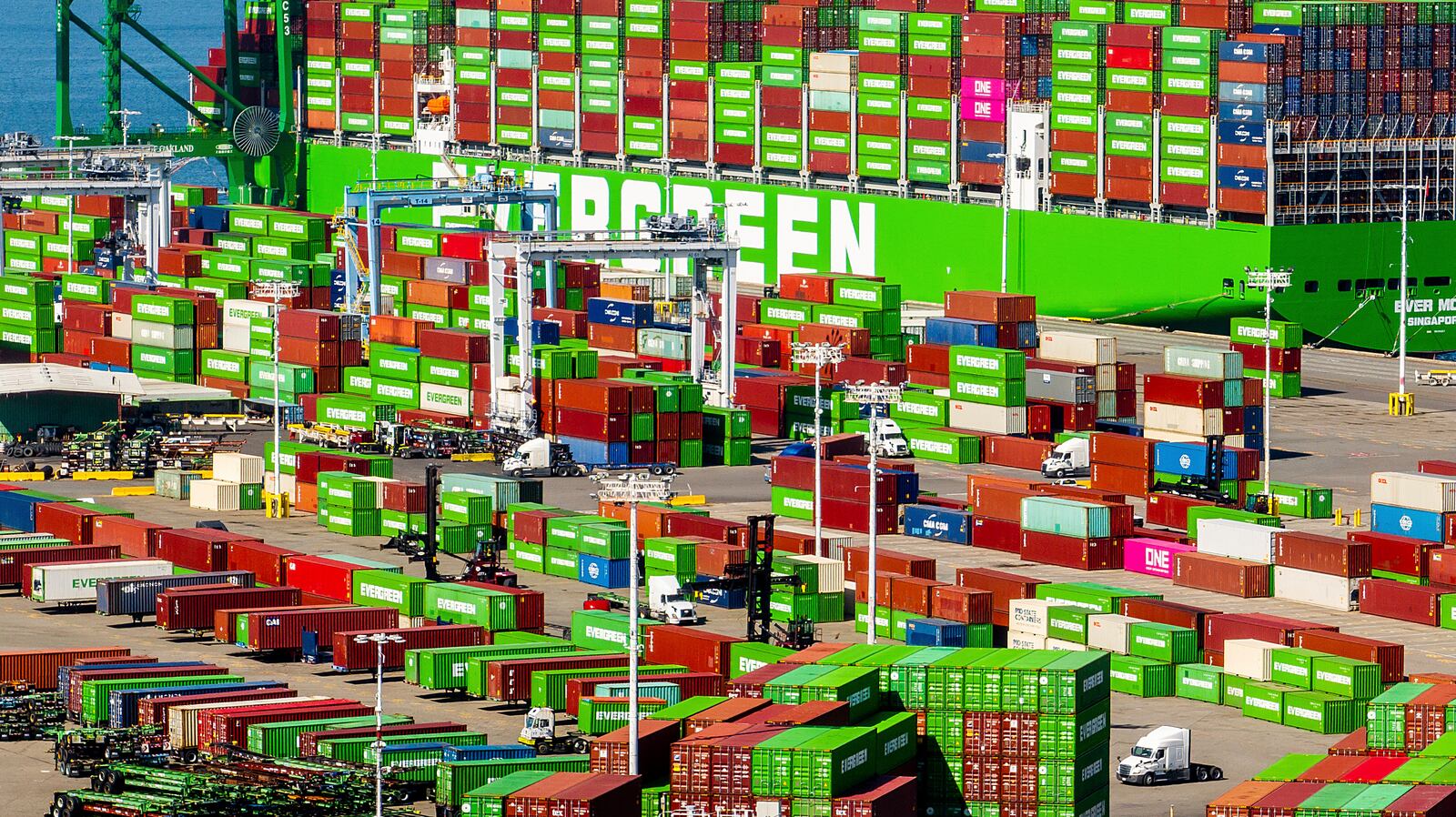 Cargo containers line a shipping terminal at the Port of Oakland on Thursday, April 3, 2025, in Oakland, Calif. (AP Photo/Noah Berger)