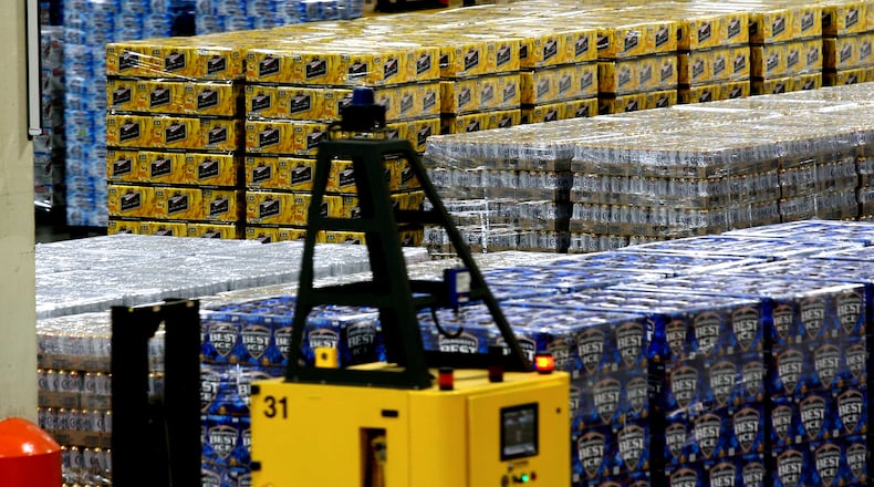 Laser guided machines move skids throughout the loading bay at the MillerCoors Brewery in Trenton. Staff