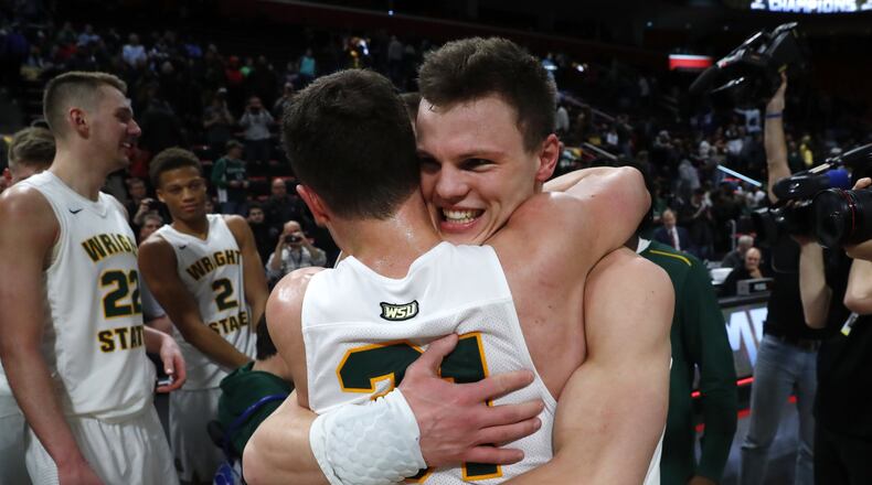 Wright State’s guard Grant Benzinger, right, celebrates with Cole Gentry after the team’s 74-57 win over Cleveland State during an NCAA college basketball game for the championship in the Horizon League men’s tournament in Detroit, Tuesday, March 6, 2018. (AP Photo/Paul Sancya)