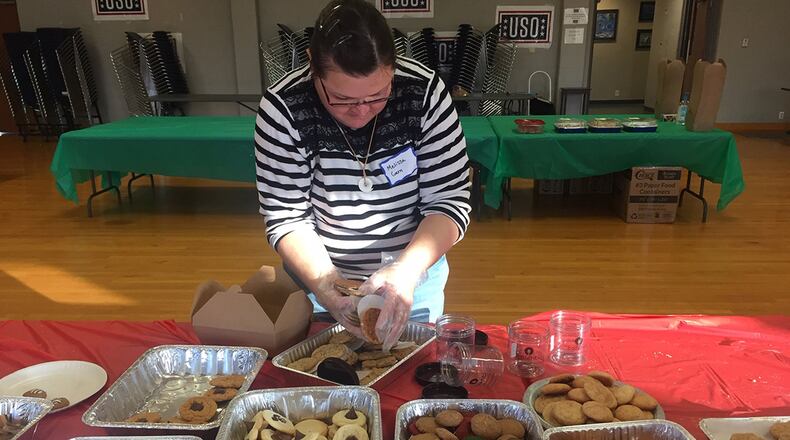 Volunteer Melissa Gerry fills a box with cookies during the 19th annual Airmen’s Holiday Cookie Drive Dec. 4 at Wright-Patterson Air Force Base. (Skywrighter photo/Amy Rollins)