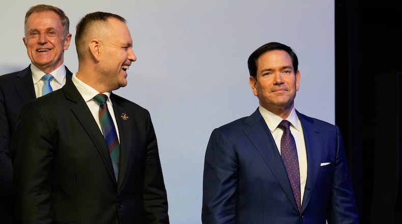 U.S. Secretary of State Marco Rubio, right, looks on ahead of a group photo at the Heads of states dinner, at the 2026 Winter Olympics, in Milan, Italy, Thursday, Feb. 5, 2026. (AP Photo/Luca Bruno, Pool)