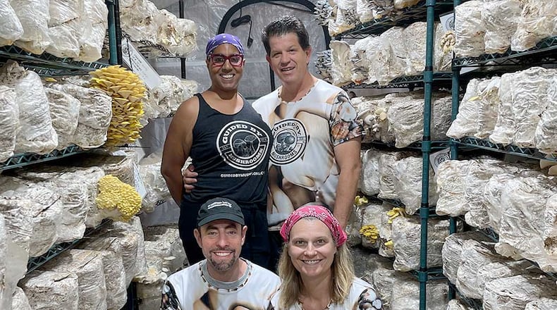 Guided by Mushrooms founders, who are surrounded by their product, are Audra and David Sparks (back row) and Michael Goldstick and Amy Cox (front row). CONTRIBUTED