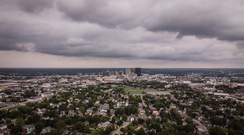 Dark clouds stream in Monday Sept. 20, over the South Park neighborhood in Dayton. The weather will cool down amid a rainy period this week. JIM NOELKER/STAFF