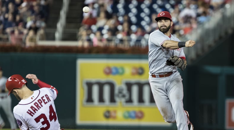 WASHINGTON, DC - AUGUST 02: Jose Peraza #9 of the Cincinnati Reds turns a double play against the Cincinnati Reds during the ninth inning at Nationals Park on August 02, 2018 in Washington, DC.  (Photo by Scott Taetsch/Getty Images)