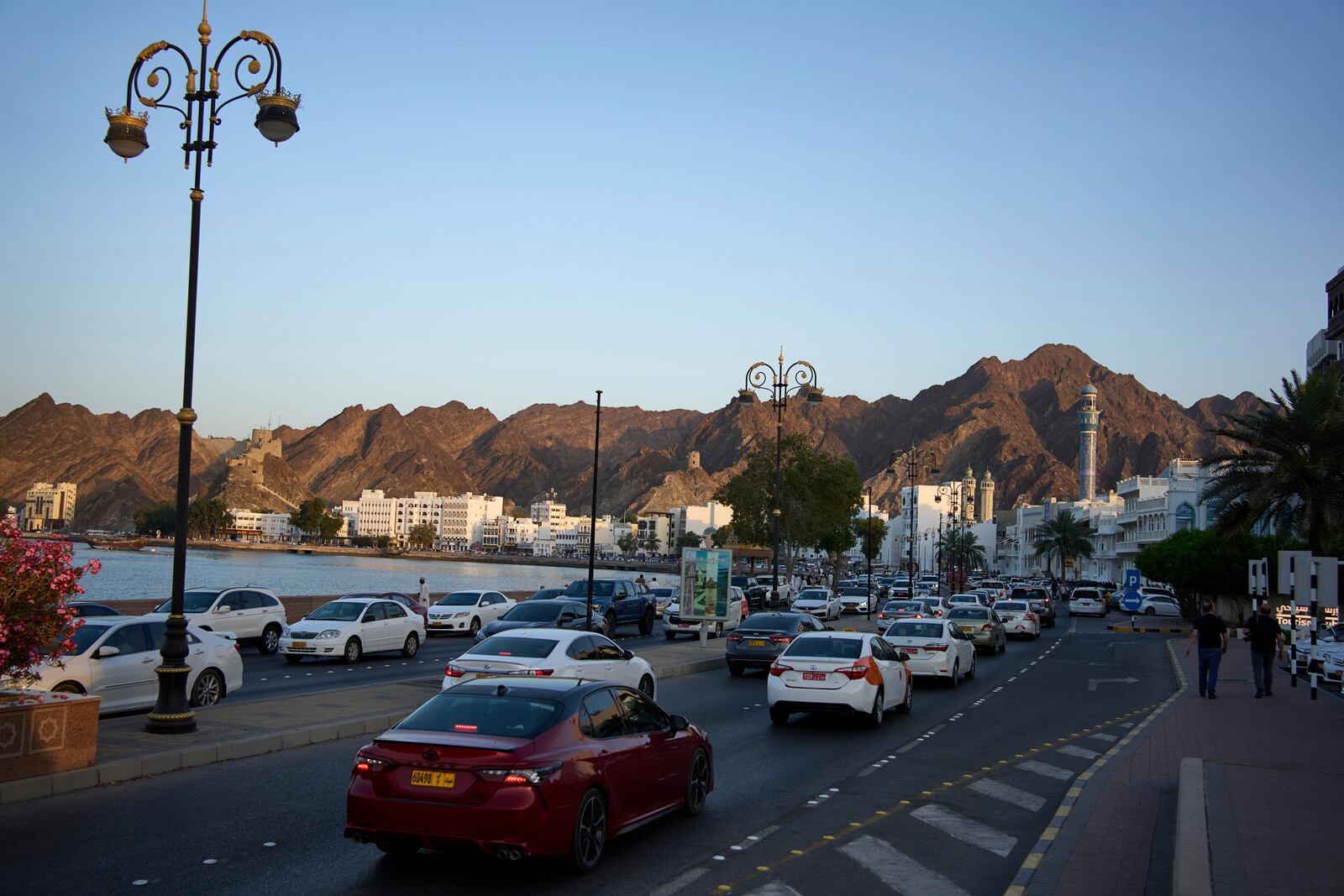Visitors and locals gather at the Mutrah Corniche in Muscat, Oman, Friday, April 11, 2025. (AP Photo/ Fatima Shbair)