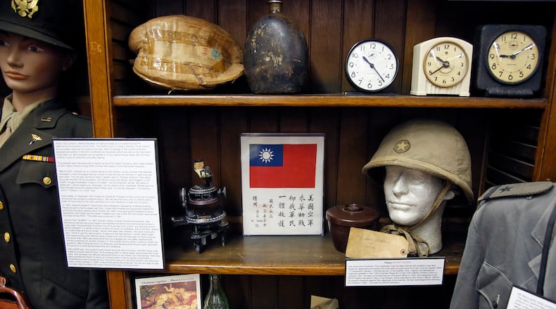 WWII artifacts, including a Japanese helmet, lower right, at the Miami Valley Military History Museum located in Building 120 on the Dayton Veterans Administration campus. TY GREENLEES / STAFF