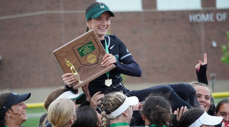 Mason senior Annabelle Geiser celebrates with his teammates after the Comets beat Springboro 10-1 in a Division I district final on Thursday at Lebanon. CHRIS VOGT / CONTRIBUTED