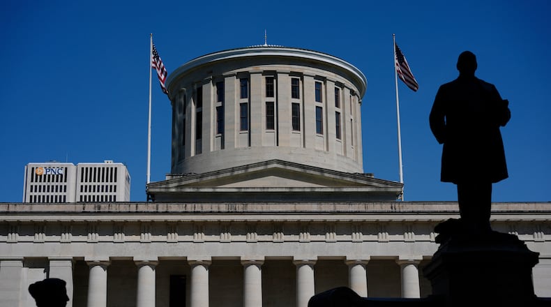 FILE - The William McKinley Monument is silhouetted in front of the west side of the Ohio Statehouse, April 15, 2024, in Columbus, Ohio. (AP Photo/Carolyn Kaster, File)