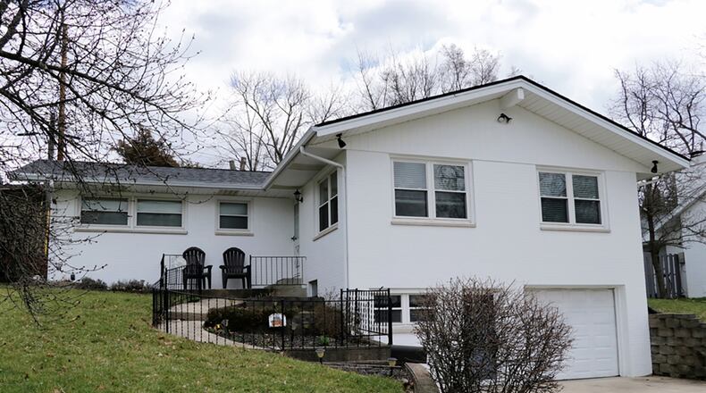 The brick ranch with 3 bedrooms has about 1,460 sq. ft. of living space on the main level. The property includes a 1-car garage with a concrete driveway. The front door next to the garage opens into a lower-level family room and finished basement. CONTRIBUTED PHOTO BY KATHY TYLER
