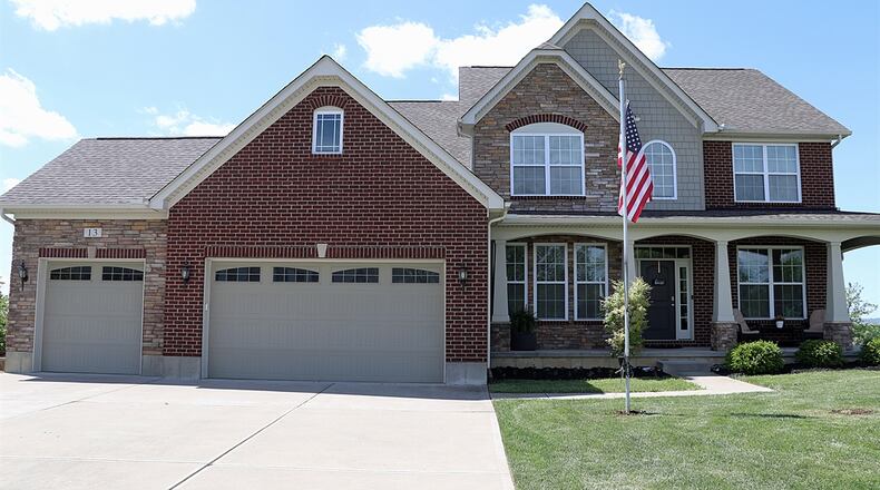 Listed for $698,896, the stone-and-plank home at 13 Buckeye Drive has about 4,463 square feet of living space. CONTRIBUTED PHOTOS