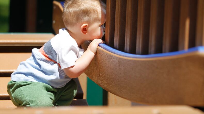 Solomon Terry, 18 months, looks for his mom and sister from a playground swinging bridge in Thomas Cloud Park in Huber Heights in this May 2016 file photo. TY GREENLEES / STAFF