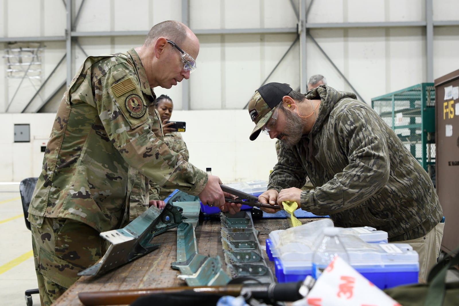 Gen. Duke Z. Richardson, Air Force Materiel Command commander, installs a fastener receptacle to an F-15 longeron assisted by Seth Mitchell, 561st Aircraft Maintenance Squadron sheet metal mechanic, at Robins Air Force Base, Georgia, in 2022.  (U.S. Air Force photo by Tommie Horton)