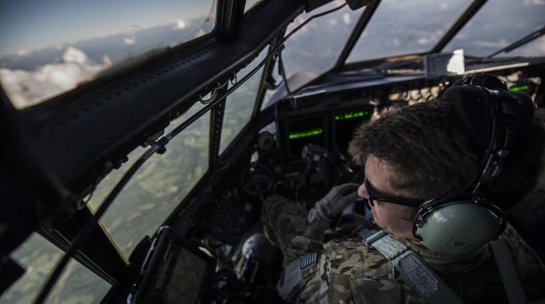A pilot with the 15th Special Operations Squadron scans the ground during routine low-level flying training during Task Force Exercise Olympus Archer at Wright Patterson Air Force Base in August 2016. Air Force photo by Staff Sgt. Christopher Callaway