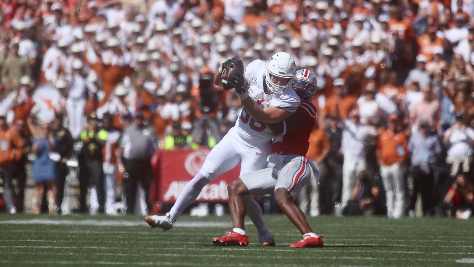 Ohio State's Caleb Downs tackles Jack Endries, of Texas, to stop the final drive by the Longhorns in the fourth quarter on Saturday, Aug. 30, 2025, at Ohio Stadium in Columbus. David Jablonski/Staff