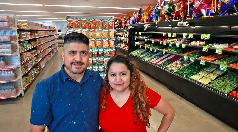 Alicia Marcado and her husband, Saul, in their new store, Adasa Latin Market, at 1883 South Limestone Street Friday, July 14, 2023. BILL LACKEY/STAFF