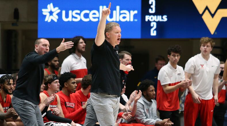 Youngstown State coach Jerrod Calhoun reacts during the second half of an NCAA college basketball game against West Virginia in Morgantown, W.Va., Wednesday, Dec. 22, 2021. (AP Photo/Kathleen Batten)