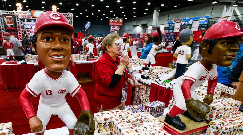 The bobblehead booth was decorated with oversized bobbleheads of former Reds players during RedsFest in December 2016 at Duke Energy Convention Center in Cincinnati. Pictured here are bobbleheads of Dave Concepcion, left, and Cesar Geronimo. NICK GRAHAM/STAFF