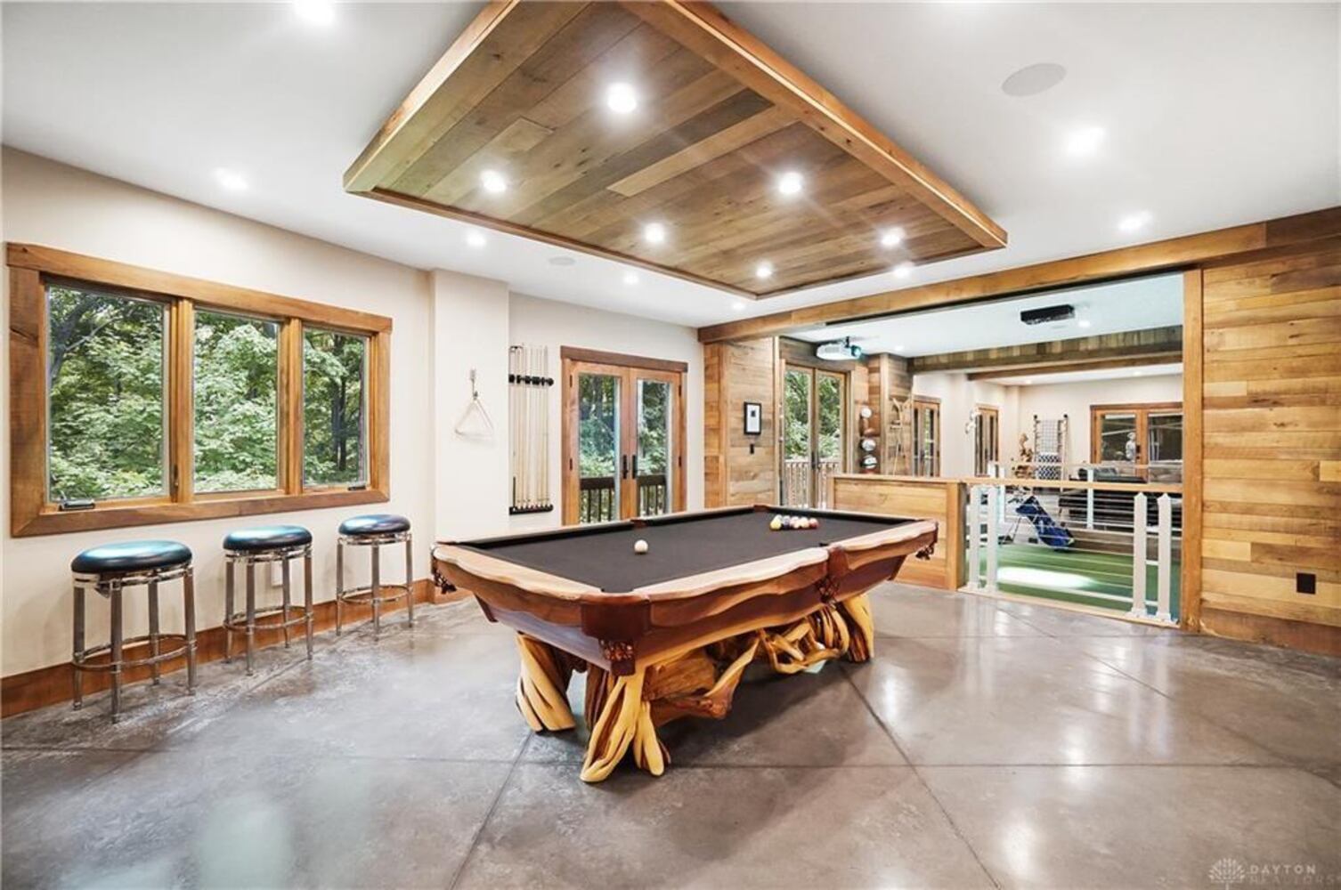 PHOTOS: Spectacular $1.8M luxury home on market with pool, golf simulator