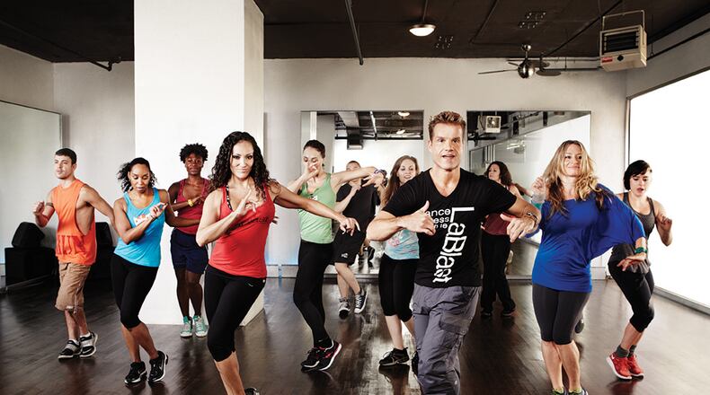 Dancing With the Stars pro Louis van Amstel (right of center) created LaBlast, a partner-free dance workout. CONTRIBUTED