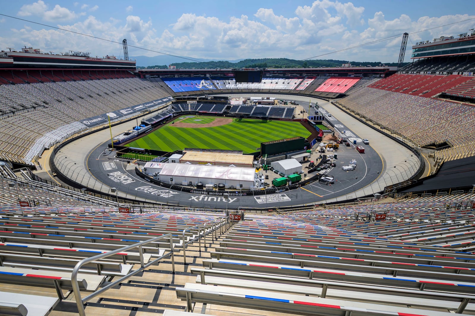 Work continues on the baseball field inside the racetrack at Bristol Motor Speedway, Friday, July 25, 2025, in Bristol, Tenn., for MLB Speedway Classic baseball game between the Cincinnati Reds and Atlanta Braves on Aug. 2. (Earl Neikirk/Bristol Motor Speedway via AP