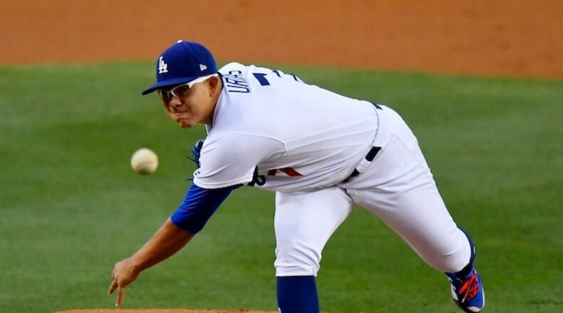 FILE - In this May 9, 2017, file photo, Los Angeles Dodgers starting pitcher Julio Urias throws during the team's baseball game against the Pittsburgh Pirates in Los Angeles. Urias, the Dodgers' top prospect, needs shoulder surgery and will miss the rest of the season. The 20-year-old is scheduled to have his left anterior capsule repaired Tuesday, June 27. (AP Photo/Mark J. Terrill, File)