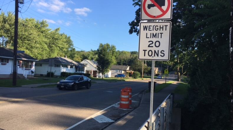 West Carrollton is planning to replace the Elm Street Bridge just south of the center of downtown. Southbound truck drivers are warned with the sign seen above. NICK BLIZZARD/STAFF