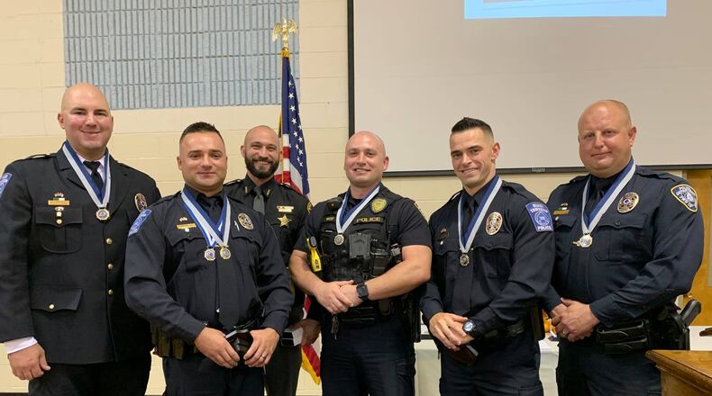 The Miami Twp. Police Department held its awards banquet ceremony in the gym of Moraine Heights Baptist Church on Oct. 17. The event honored the township's officers for their dedication to the community. Distinguished Service Award recipients included (from left): Eric Wooddell, William Olinger, Kory Caldwell, Jordan West, Austin Snowden and Scott Snell.