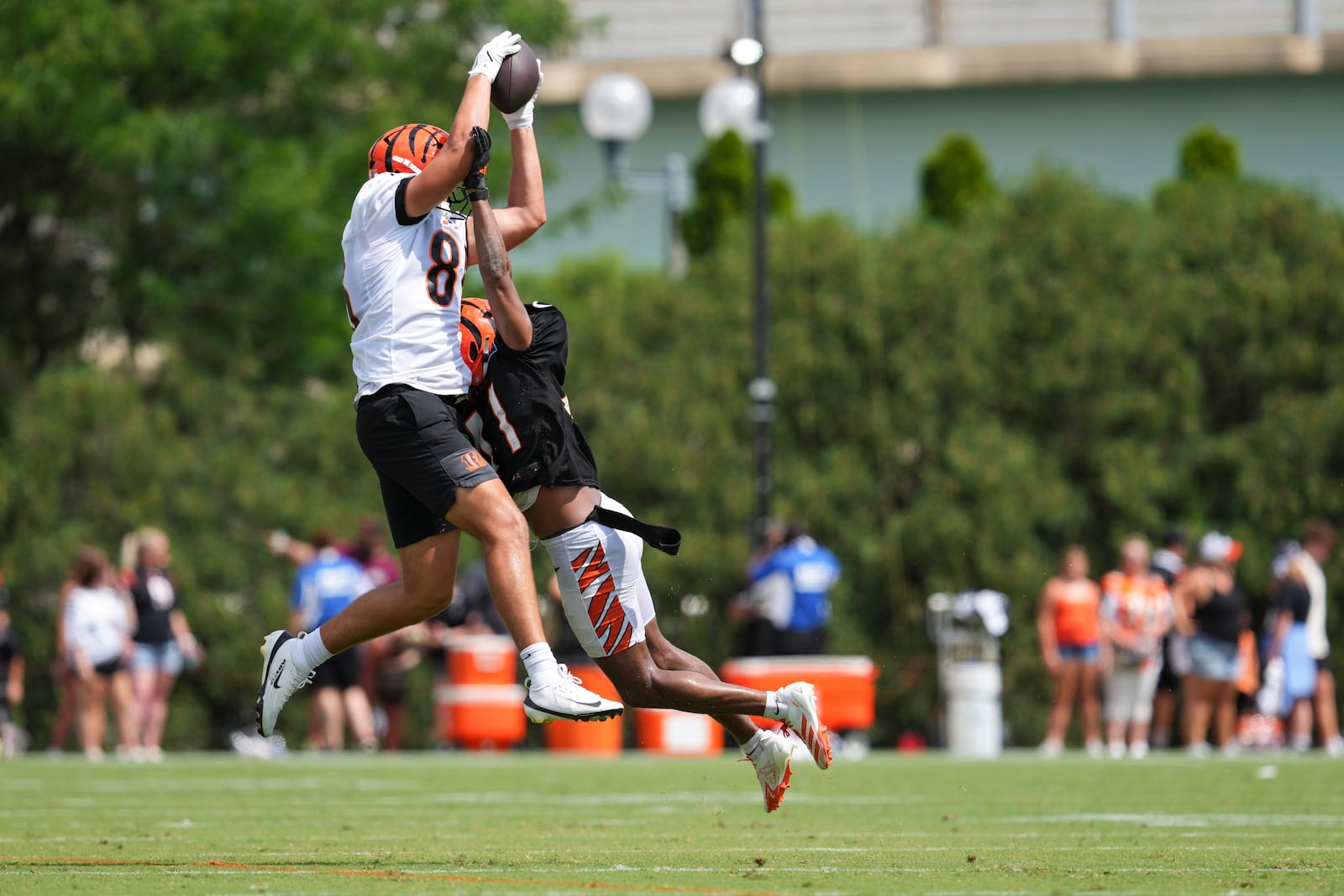 Cincinnati Bengals wide receiver Andrei Iosivas (80) makes a catch against cornerback Nate Brooks (41) during practice at the team's NFL football training camp, Sunday, July 27, 2025, in Cincinnati. (AP Photo/Jeff Dean)