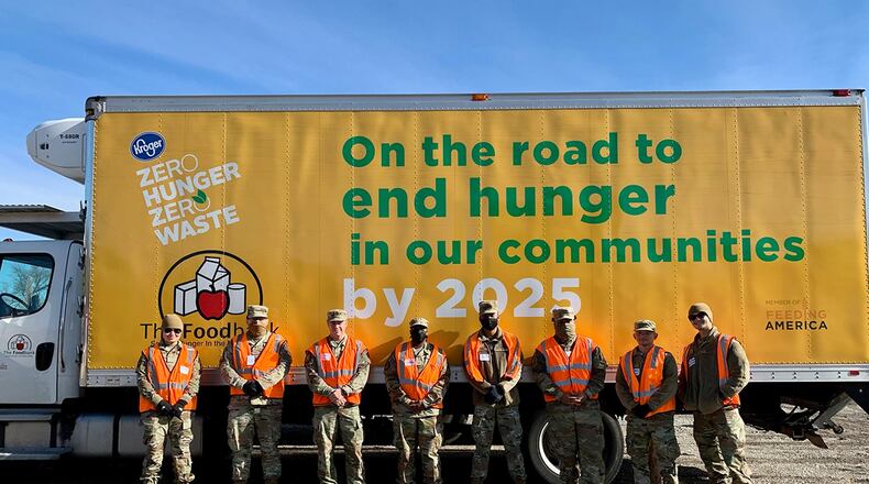 National Air and Space Intelligence Center volunteers are pictured in front of The Foodbank truck Nov. 23. The Airmen spent hours unloading, organizing and distributing Thanksgiving food for local families. CONTRIBUTED PHOTO