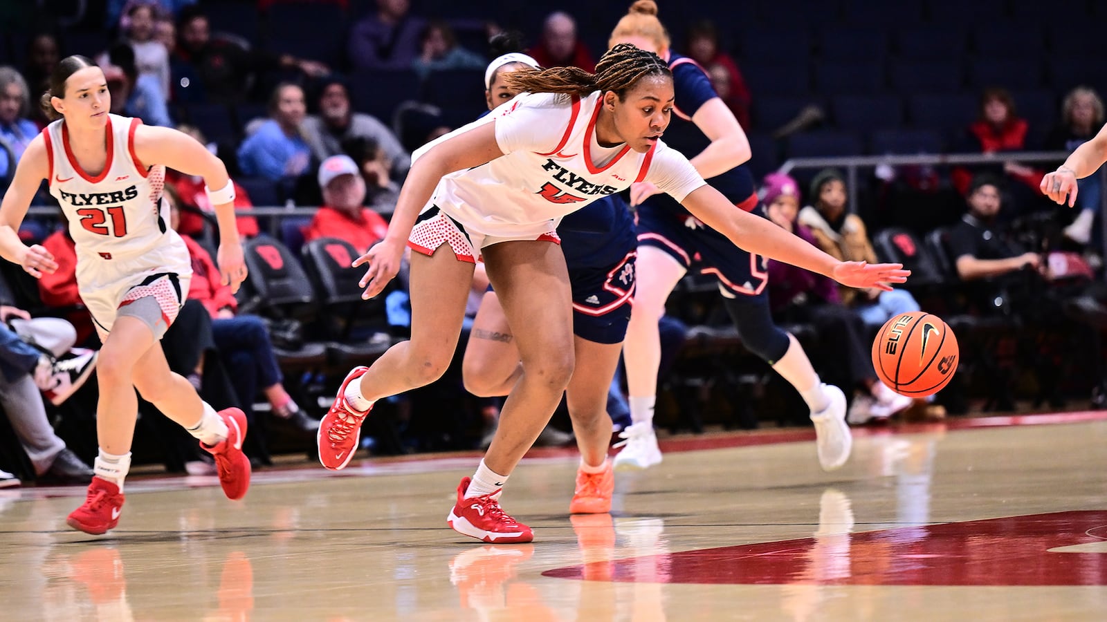 Dayton's MG Talle reaches for a loose ball during their game against Richmond on Wednesday, Jan. 14 at UD Arena. ERIK SCHELKUN / CONTRIBUTED PHOTO