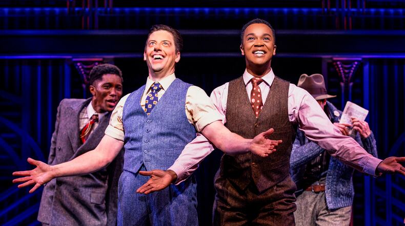 This image released by Polk & Co. shows Christian Borle, foreground left, and J. Harrison Ghee, right, during a performance of the musical "Some Like It Hot." (Marc J. Franklin/Polk & Co. via AP)