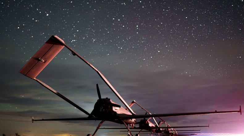 Long-range drones An-196 Liutyi of the Ukrainian 14th Separate Unmanned Aerial Systems Regiment stand in line before takeoff in undisclosed location, Ukraine, Tuesday, Oct. 14, 2025. (AP Photo/Evgeniy Maloletka)