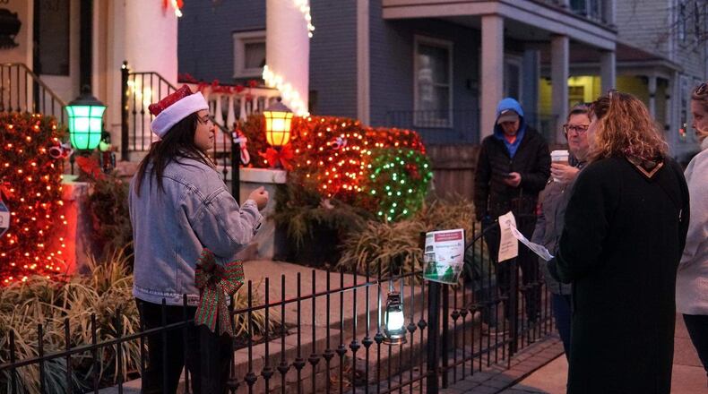 Gretchen Winterhalter (left) talks about her home during an outdoor Christmas walking tour in 2019. CONTRIBUTED