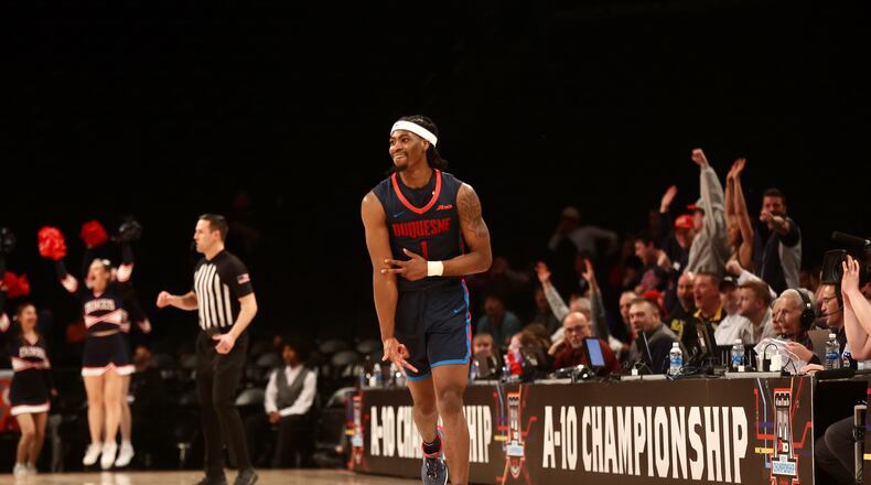 Duquesne's Jimmy Clark III celebrates after making a 3-pointer against Dayton in the final minutes in the Atlantic 10 Conference tournament quarterfinals on Thursday, March 14, 2024, at the Barclays Center in Brooklyn, N.Y. David Jablonski/Staff
