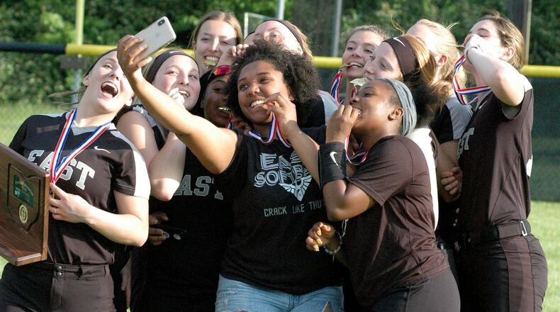 It was selfie time for Lakota East’s softball players Friday after their 3-0 victory over Lebanon in a Division I district championship game at Centerville. RICK CASSANO/STAFF