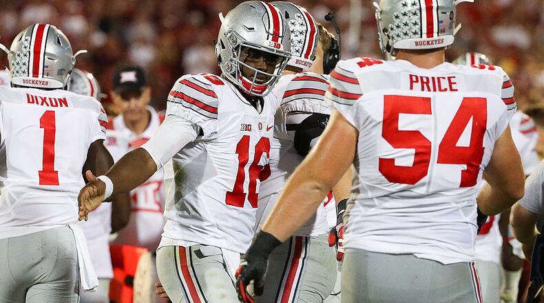 NORMAN, OK - SEPTEMBER 17: J.T. Barrett #16 of the Ohio State Buckeyes celebrates a touchdown with Billy Price #54 against the Oklahoma Sooners at Gaylord Family Oklahoma Memorial Stadium on September 17, 2016 in Norman, Oklahoma. (Photo by Scott Halleran/Getty Images)