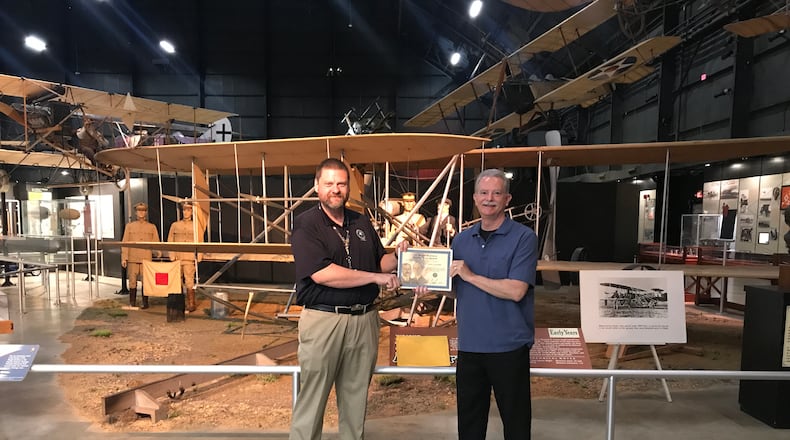 Jack Sprankle (right) received his Master Pilot Award from FAA Safety Team Program Manager Jason Forshey in front of the Wright Brother's 1909 aircraft at the National Museum of the United States Air Force.