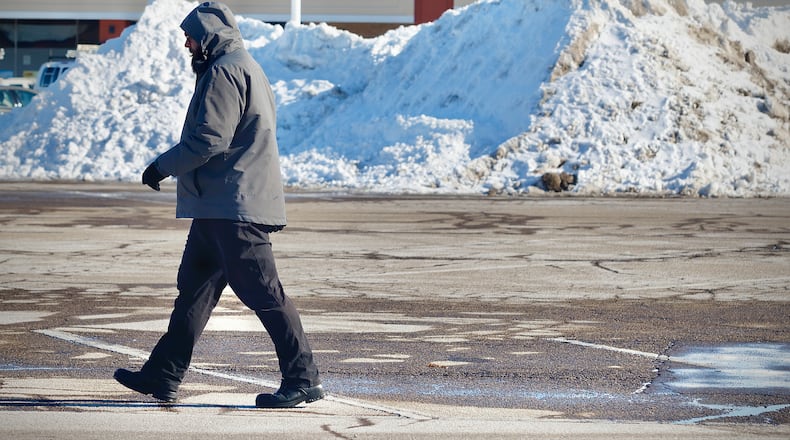 With temperatures being in the single digits, piles of snow like these at Airway Plaza shopping center aren’t going away anytime soon. MARSHALL GORBY \STAFF
