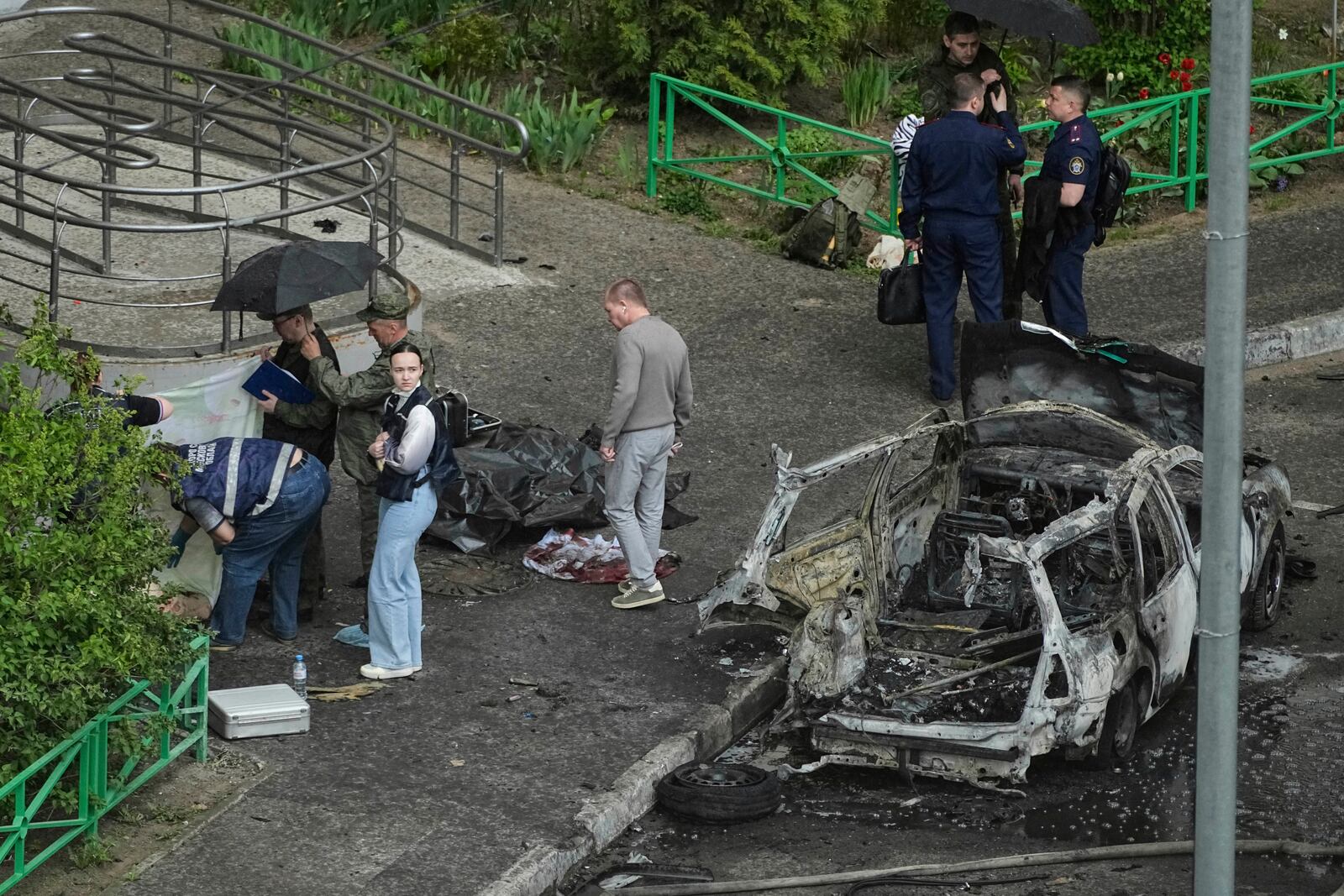 Investigators work at the scene where Lt. Gen. Yaroslav Moskalik, a deputy head of the main operational department in the General Staff of the Russian armed forces, was killed by an explosive device placed in his car in Balashikha, just outside Moscow, Russia, on Friday, April 25, 2025. (AP Photo)