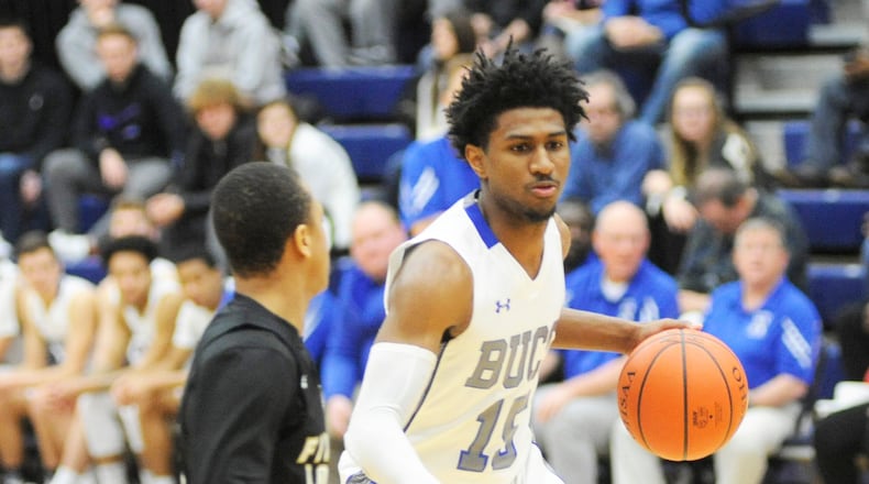 Xenia’s Samari Curtis (with ball) scored 44 points in an 89-80 loss to First Love Christian Academy (Pa.) at Flyin’ to the Hoop last month. MARC PENDLETON / STAFF