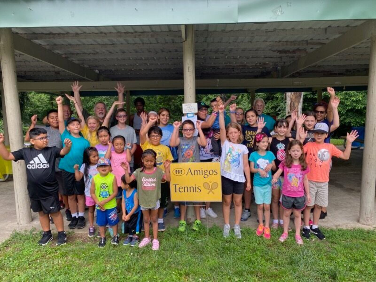 Some of the participants in the Amigos Youth Tennis program that Gene Hambrick helped launch. CONTRIBUTED